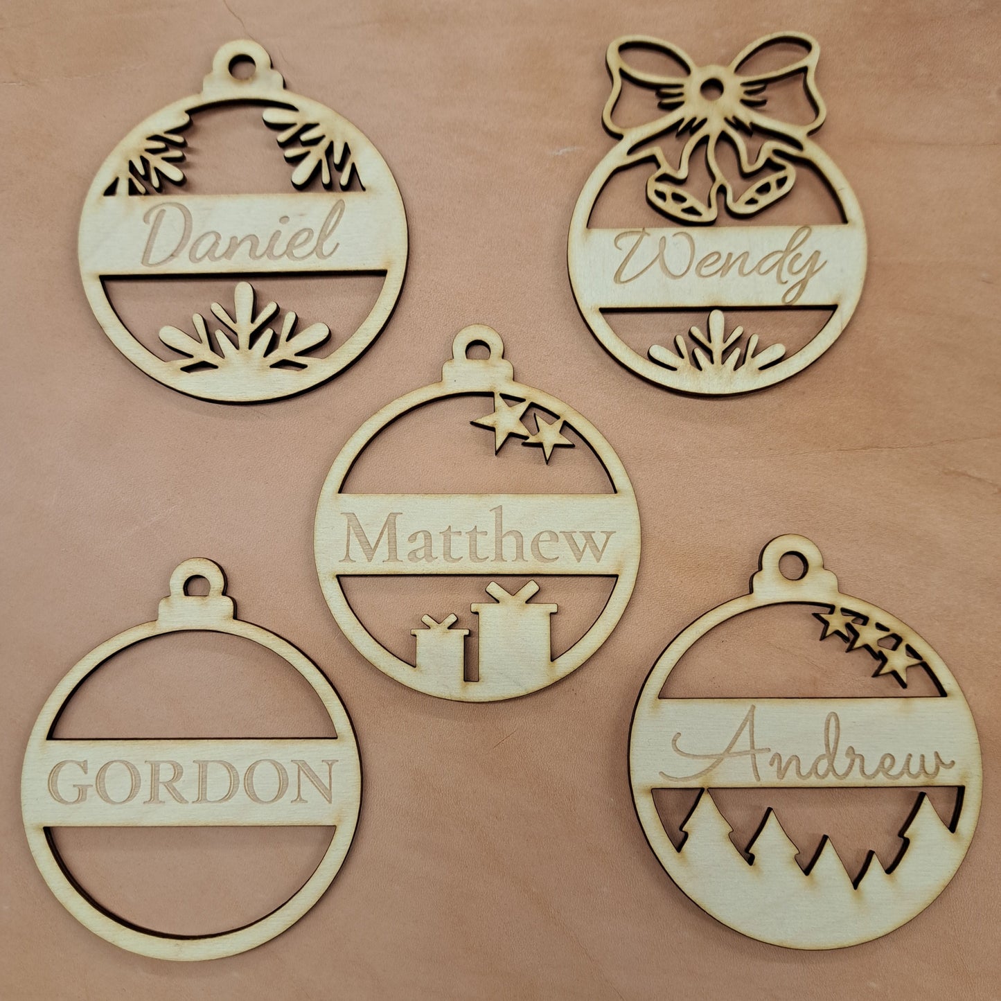 five personalized ornaments engraved