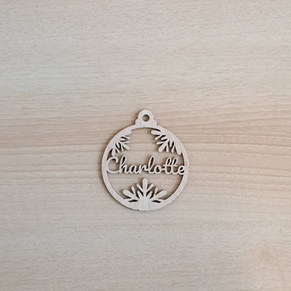 laser cut ornament with three snowflakes and name Charlotte cut